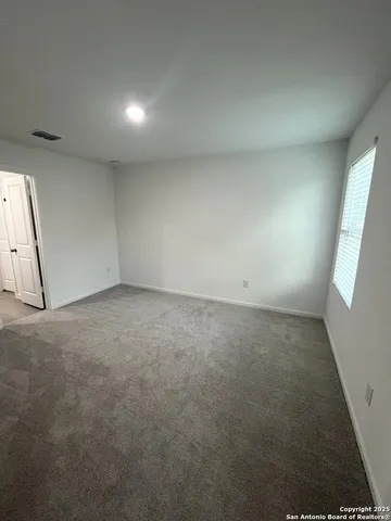 a bathroom with a shower a toilet and a sink