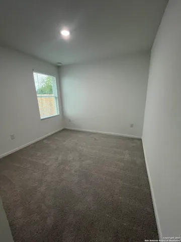 a bathroom with a toilet and a bath tub