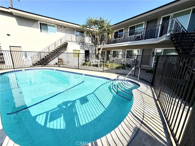a swimming pool with outdoor seating and yard