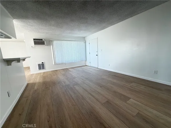 a view of a livingroom with wooden floor