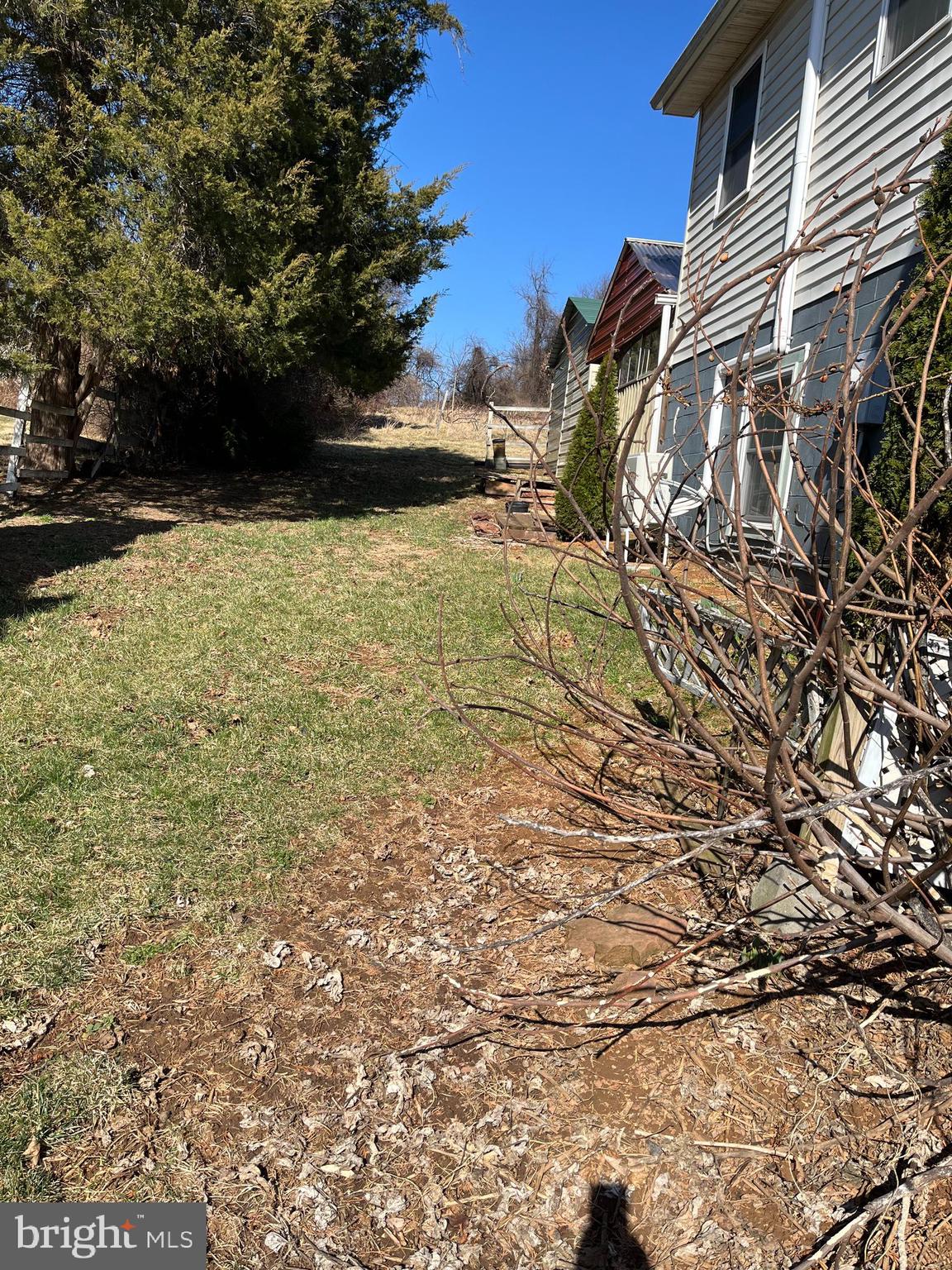 18936 Harmony Church Road Leesburg, VA 20175 - Photo 12 of 60 Clear Open Space at Side of Smaller House