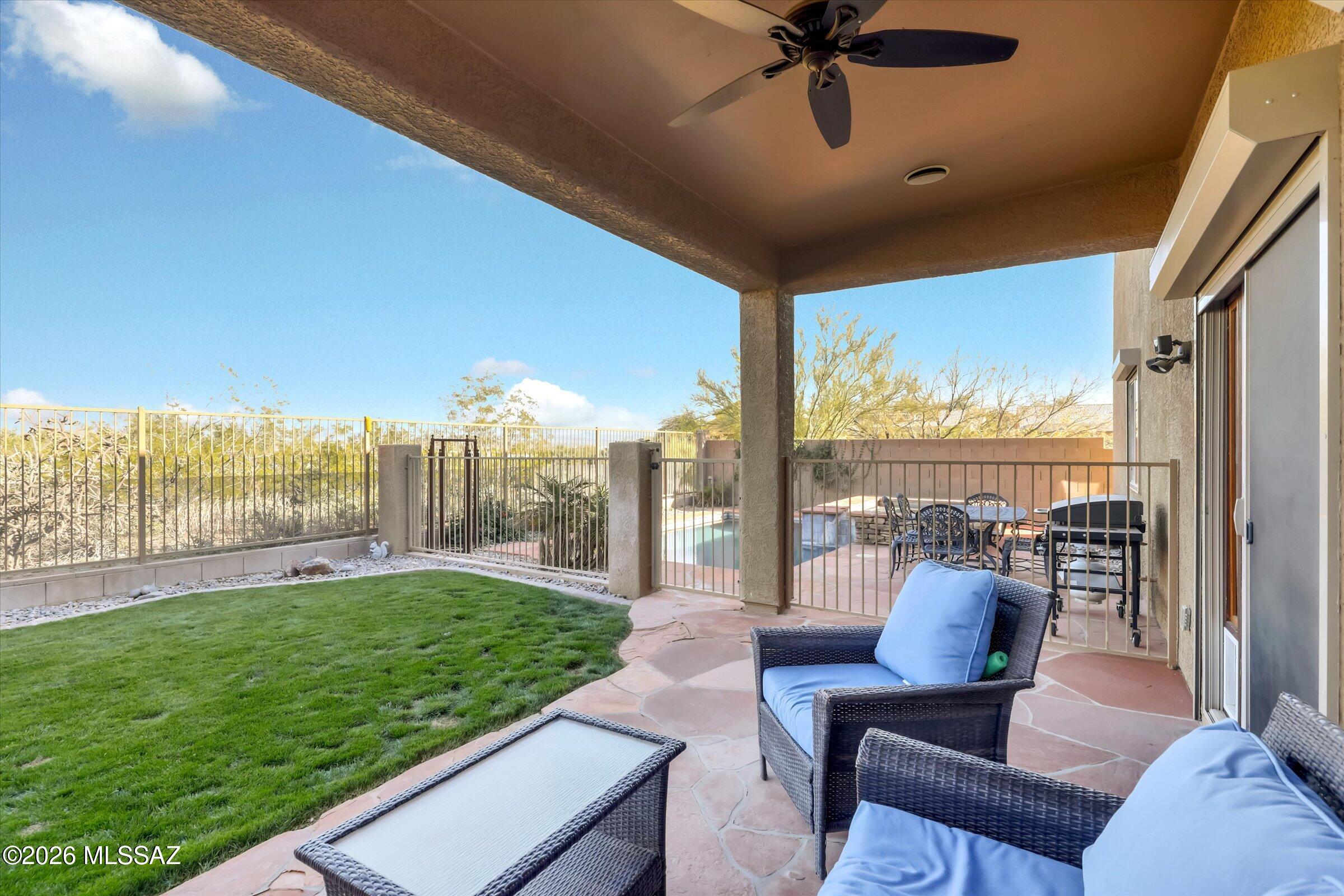 6095 South Jakemp Trail Tucson, AZ 85747 - Photo 43 of 52 a view of a roof deck with couches and pool