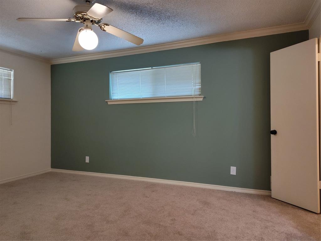 910 Worcester Lane Garland, TX 75040 - Photo 13 of 15 a view of an empty room with a window