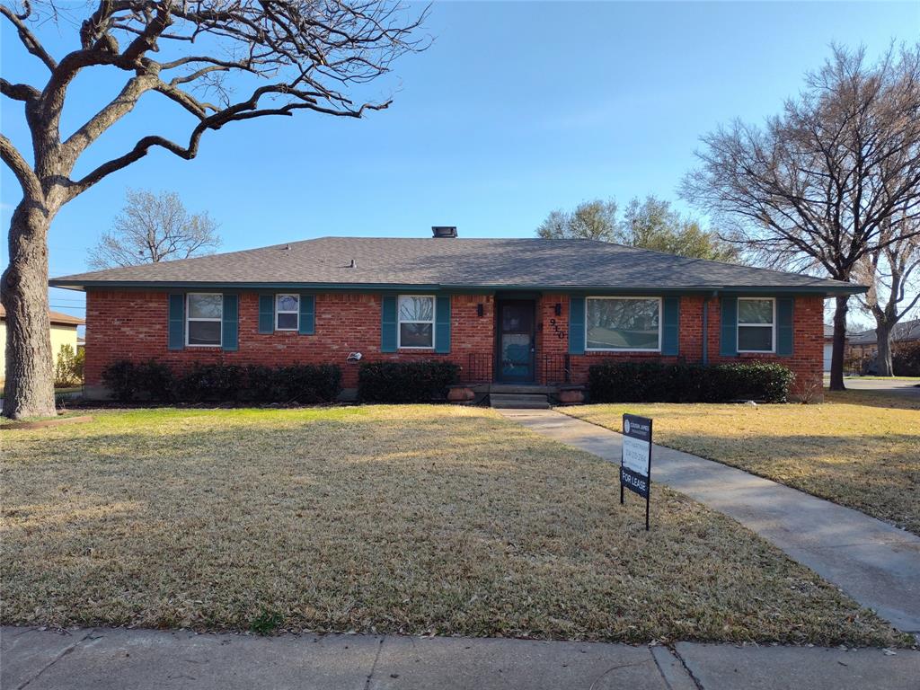 910 Worcester Lane Garland, TX 75040 - Photo 2 of 15 a front view of a house with a yard