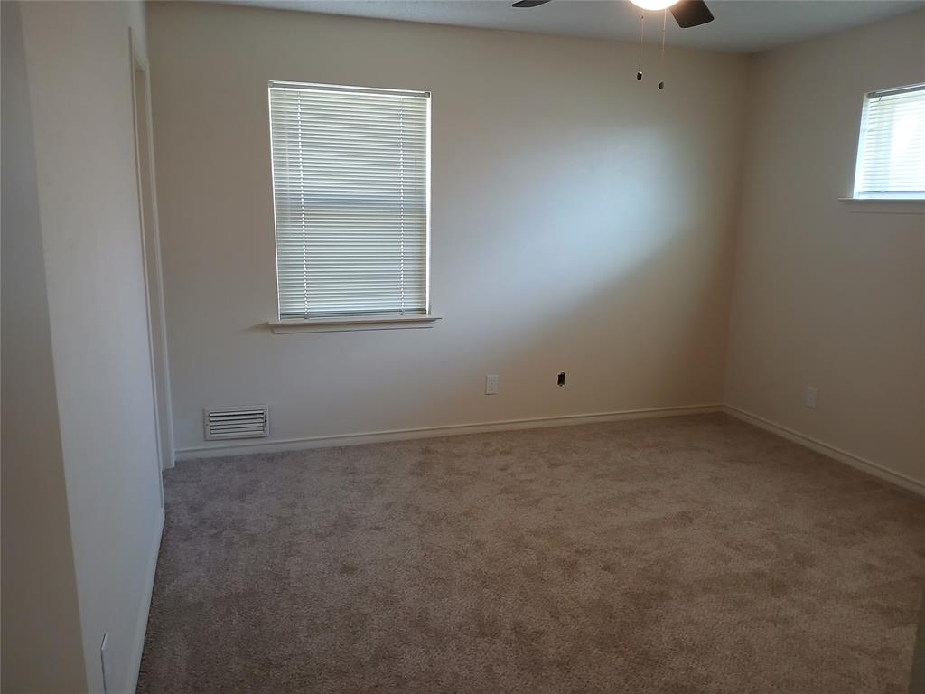 910 Worcester Lane Garland, TX 75040 - Photo 5 of 15 an empty room with a window