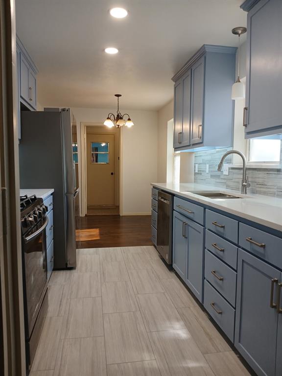 910 Worcester Lane Garland, TX 75040 - Photo 8 of 15 a kitchen with stainless steel appliances granite countertop a refrigerator and a sink