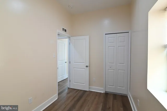 a view of room with hardwood floor