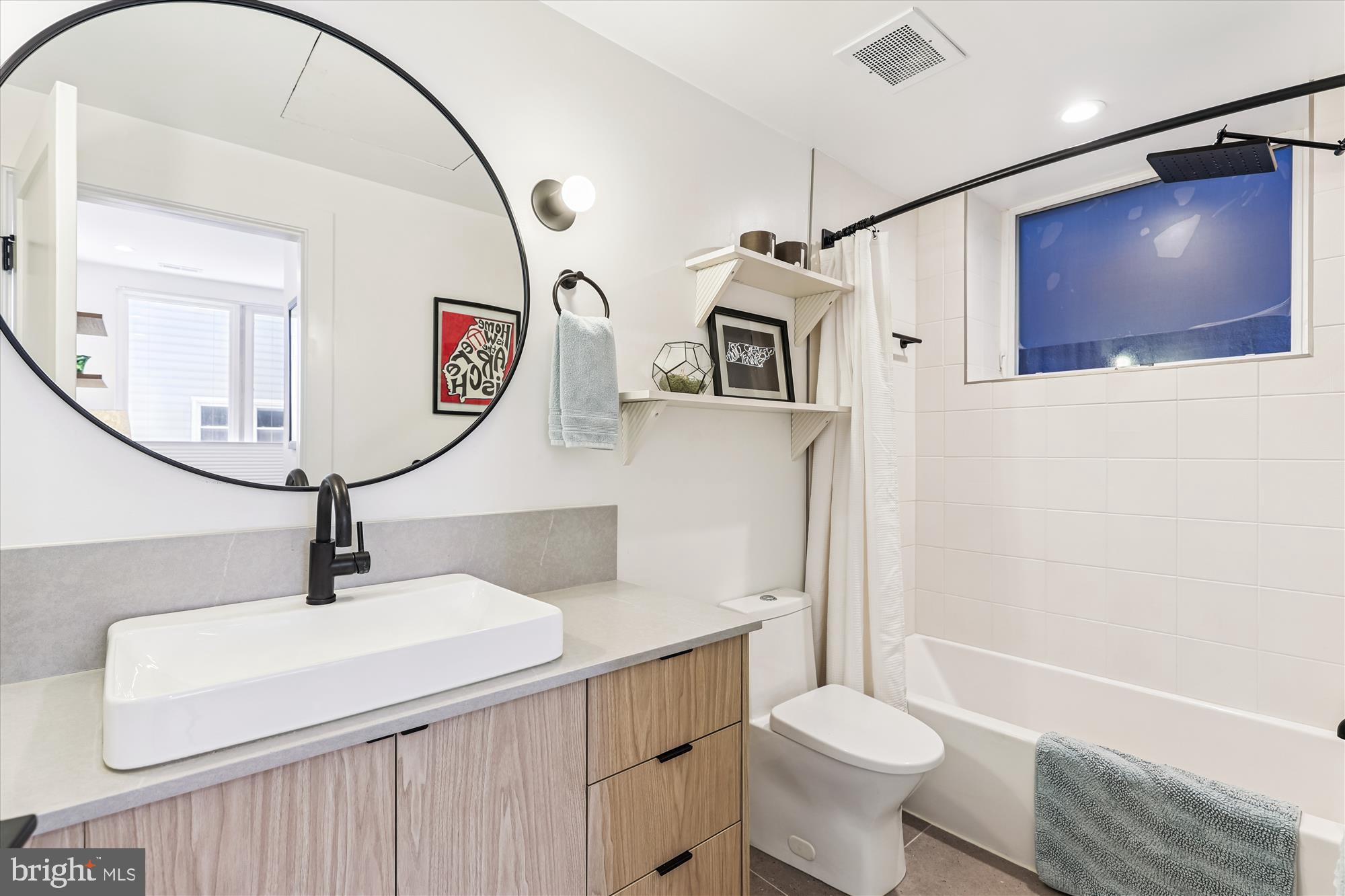 3117 Georgia Avenue Northwest, Unit 102 Washington, DC 20010 - Photo 15 of 30 a bathroom with a sink a toilet and shower