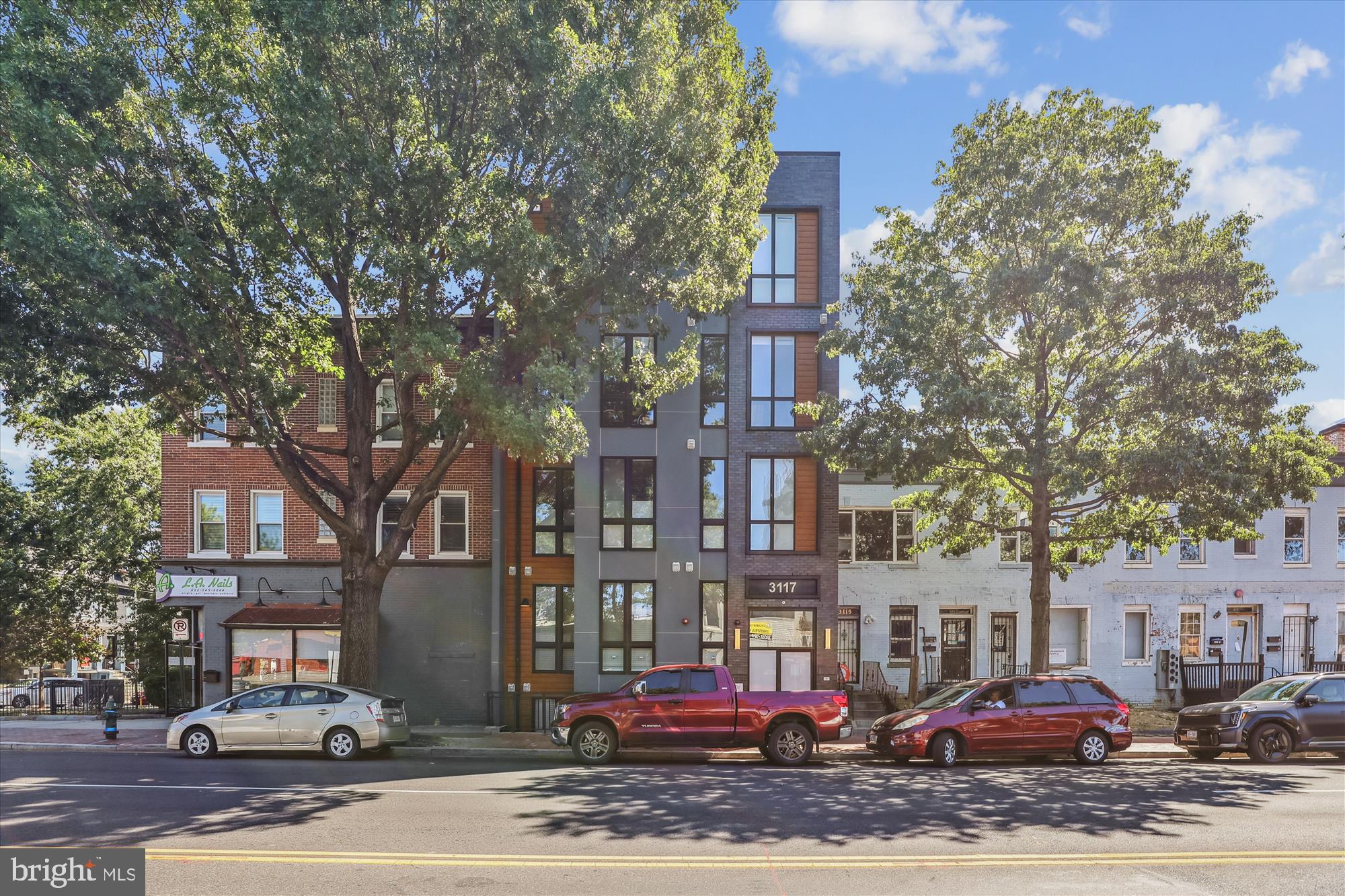 3117 Georgia Avenue Northwest, Unit 102 Washington, DC 20010 - Photo 19 of 30 a buildings covered with tall trees