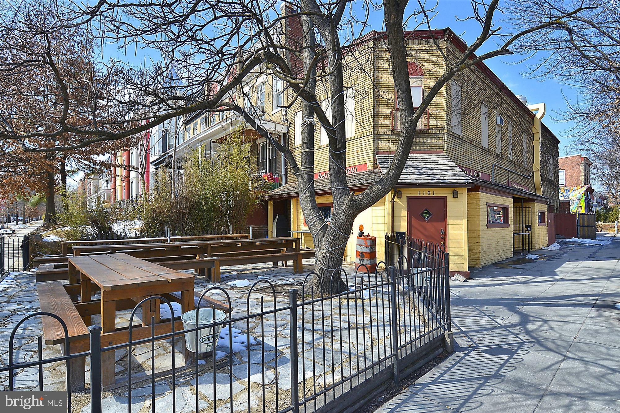 3117 Georgia Avenue Northwest, Unit 102 Washington, DC 20010 - Photo 30 of 30 a view of a brick house with many windows