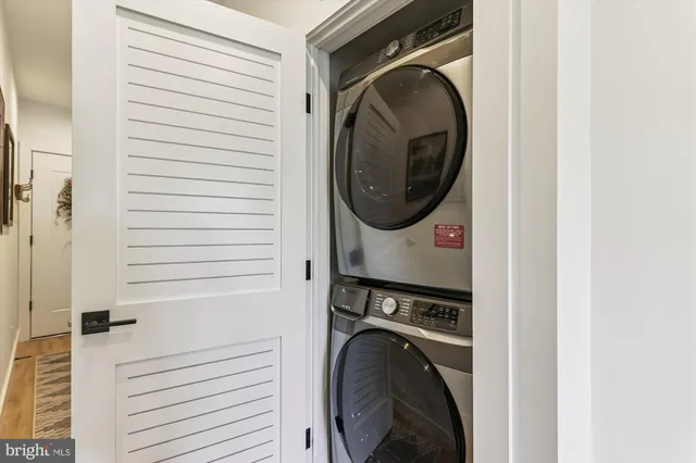 a view of a hallway with washer and dryer