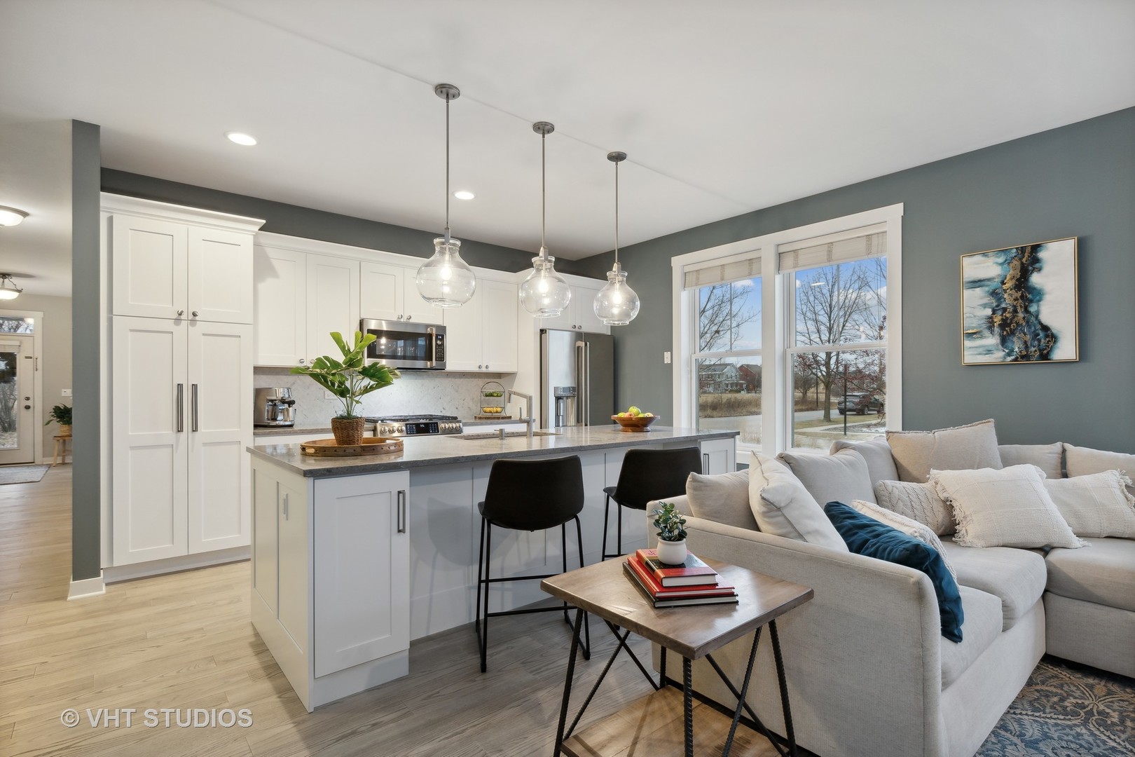 1403 Turks Cap Road Grayslake, IL 60030 - Photo 12 of 40 a kitchen with stainless steel appliances granite countertop a refrigerator a sink dishwasher a stove and a dining table with wooden floor