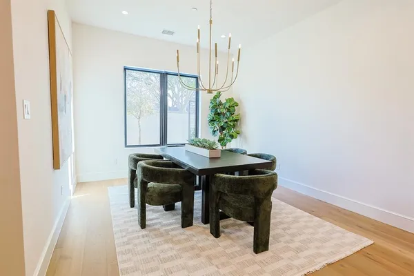 a view of a chairs and table in patio