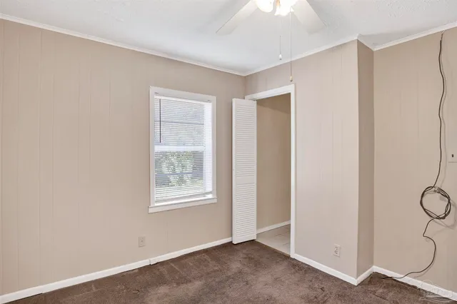 a view of an empty room with windows