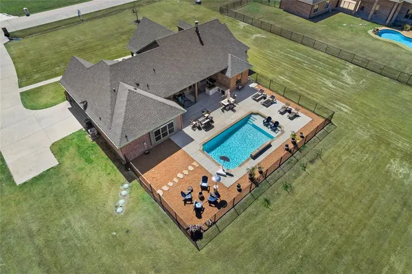 an aerial view of a house with a garden