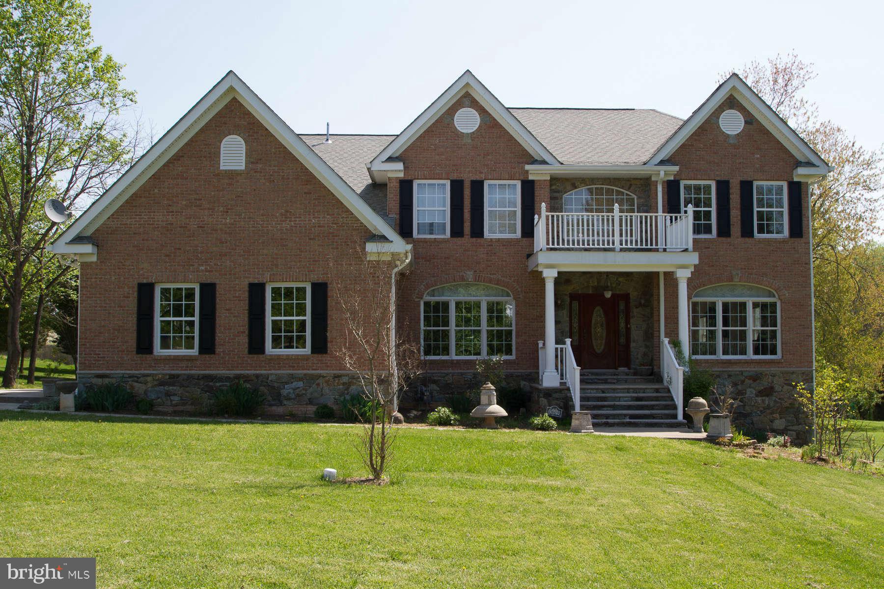 13609 Layhill Road Silver Spring, MD 20906 - Photo 1 of 30 a front view of a house with a yard