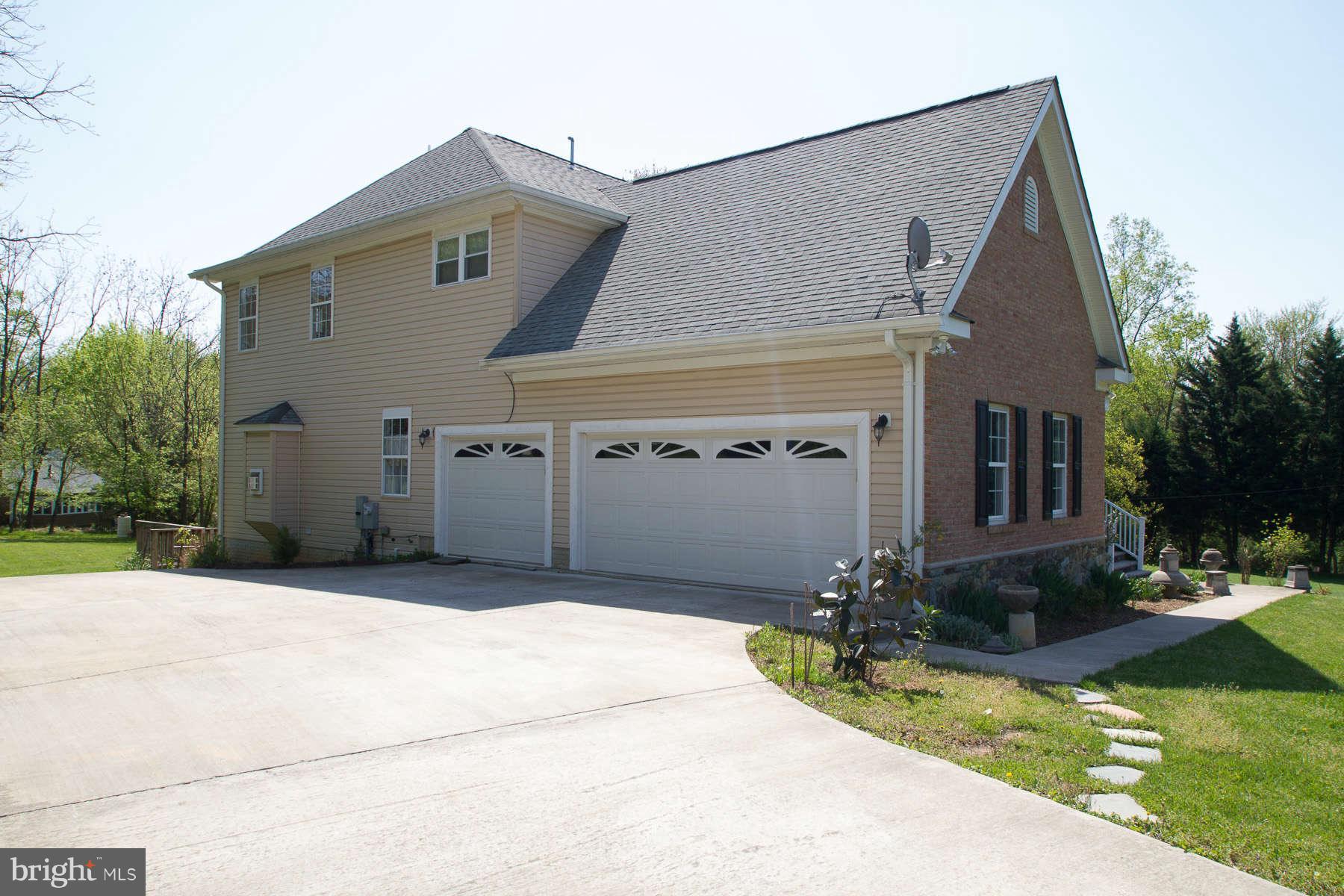 13609 Layhill Road Silver Spring, MD 20906 - Photo 2 of 30 a front view of a house with a yard