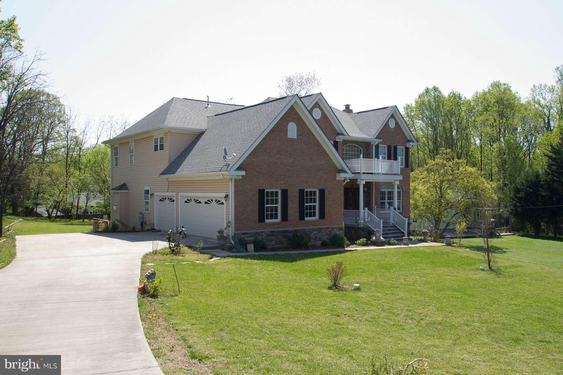 13609 Layhill Road Silver Spring, MD 20906 - Photo 3 of 30 a front view of a house with a yard