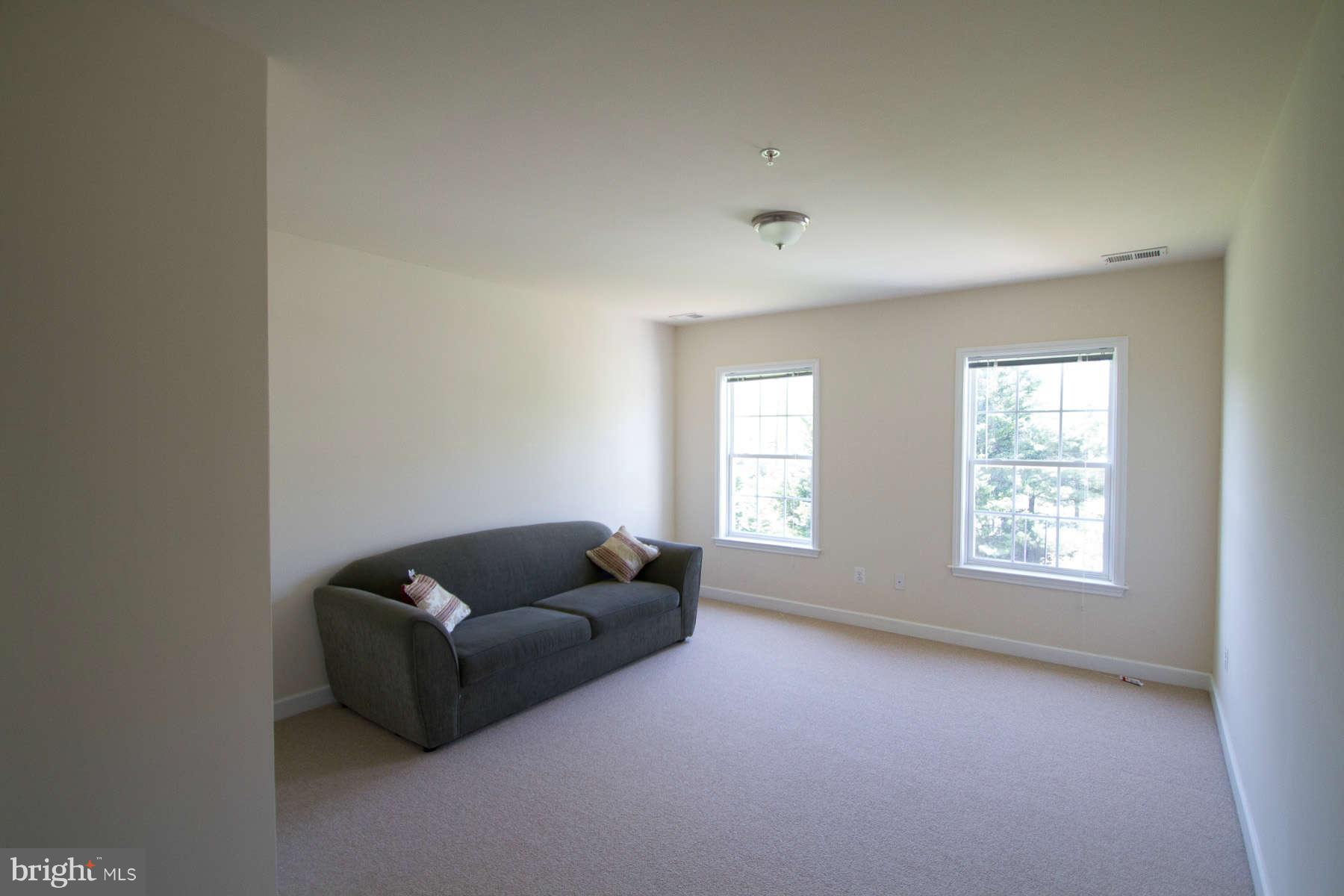 13609 Layhill Road Silver Spring, MD 20906 - Photo 23 of 30 a living room with furniture and a window