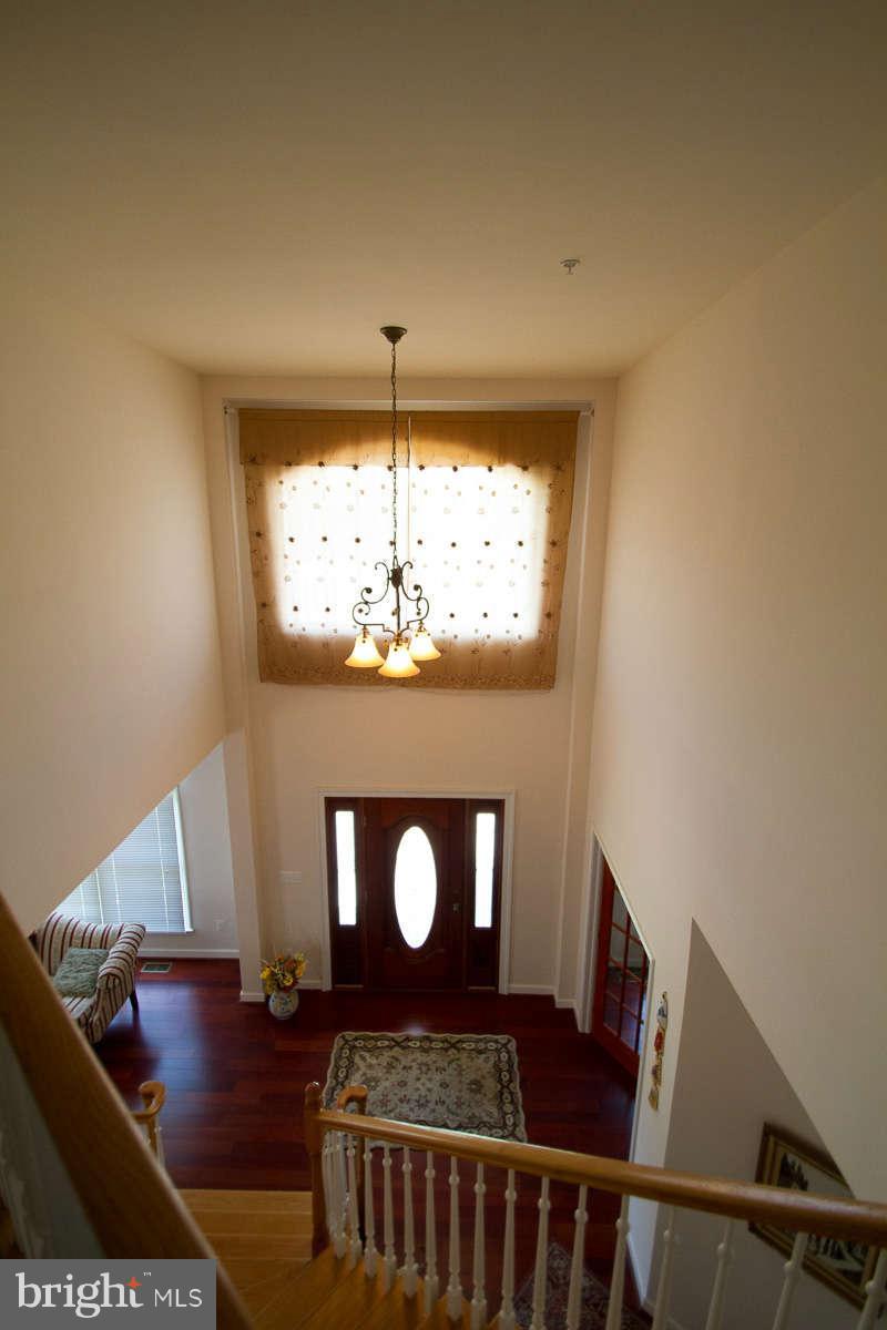 13609 Layhill Road Silver Spring, MD 20906 - Photo 24 of 30 a view of a livingroom with wooden floor and a fireplace