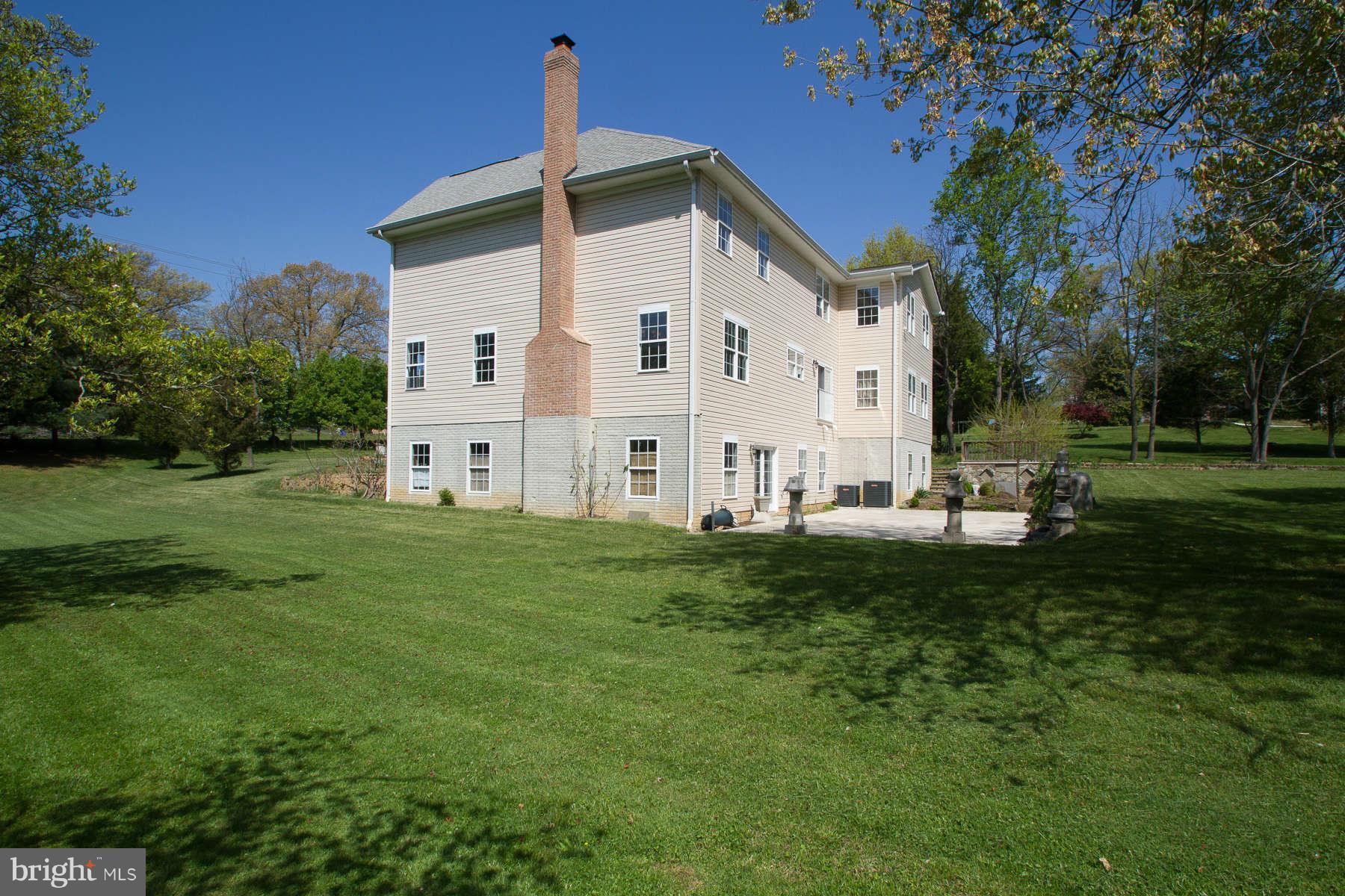 13609 Layhill Road Silver Spring, MD 20906 - Photo 29 of 30 a view of a white house with a big yard and large trees