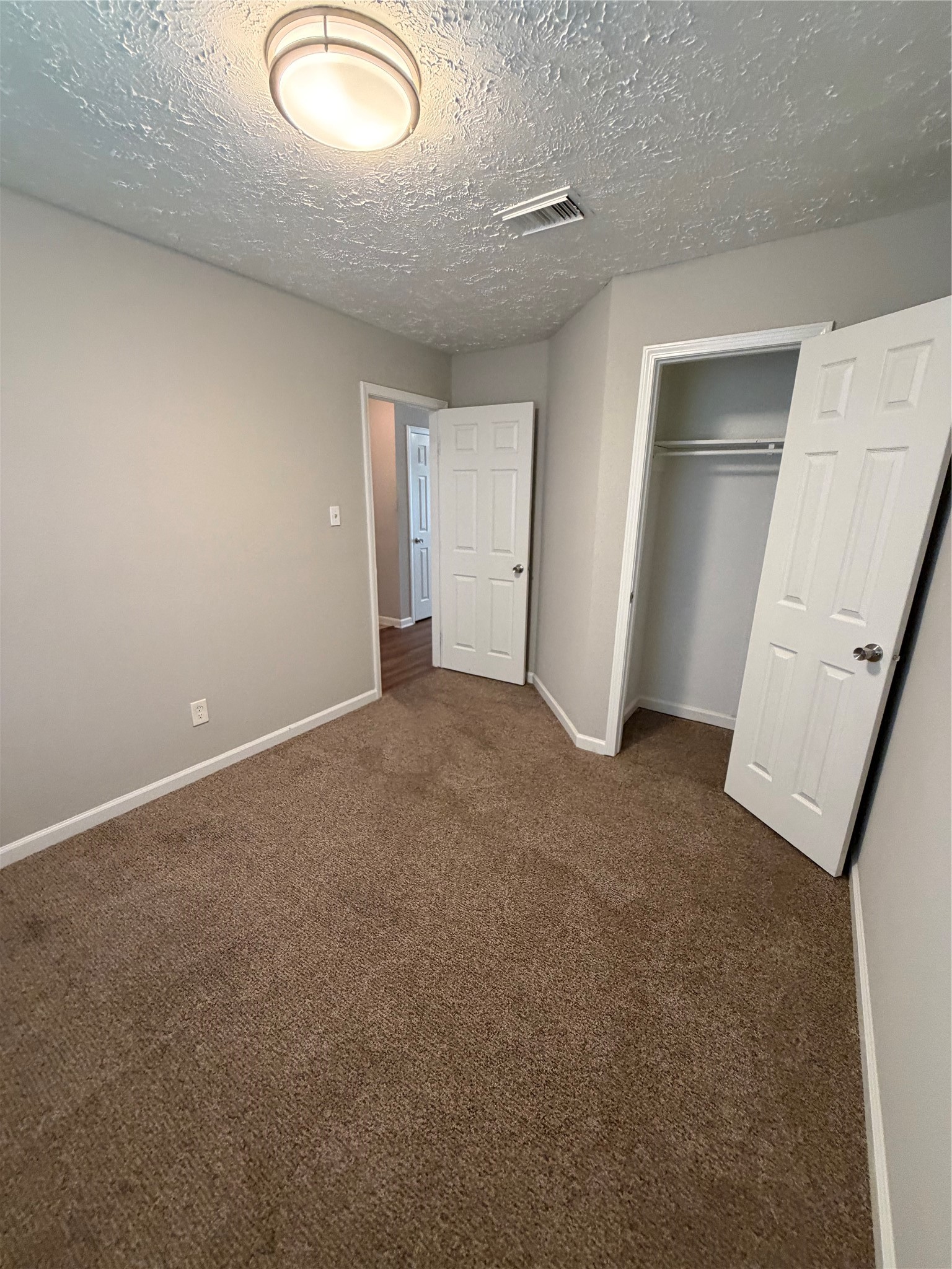 8662 Pearl Point Street Houston, TX 77044 - Photo 19 of 28 an empty room with windows