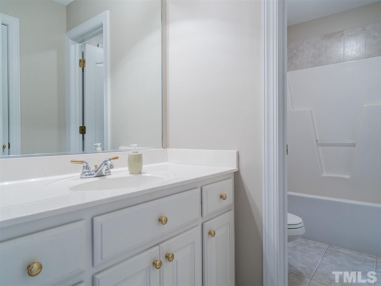 1025 Grissom Farm Road Garner, NC 27529 - Photo 21 of 30 This space is ideal for sharing with the separated shower and vanity areas.