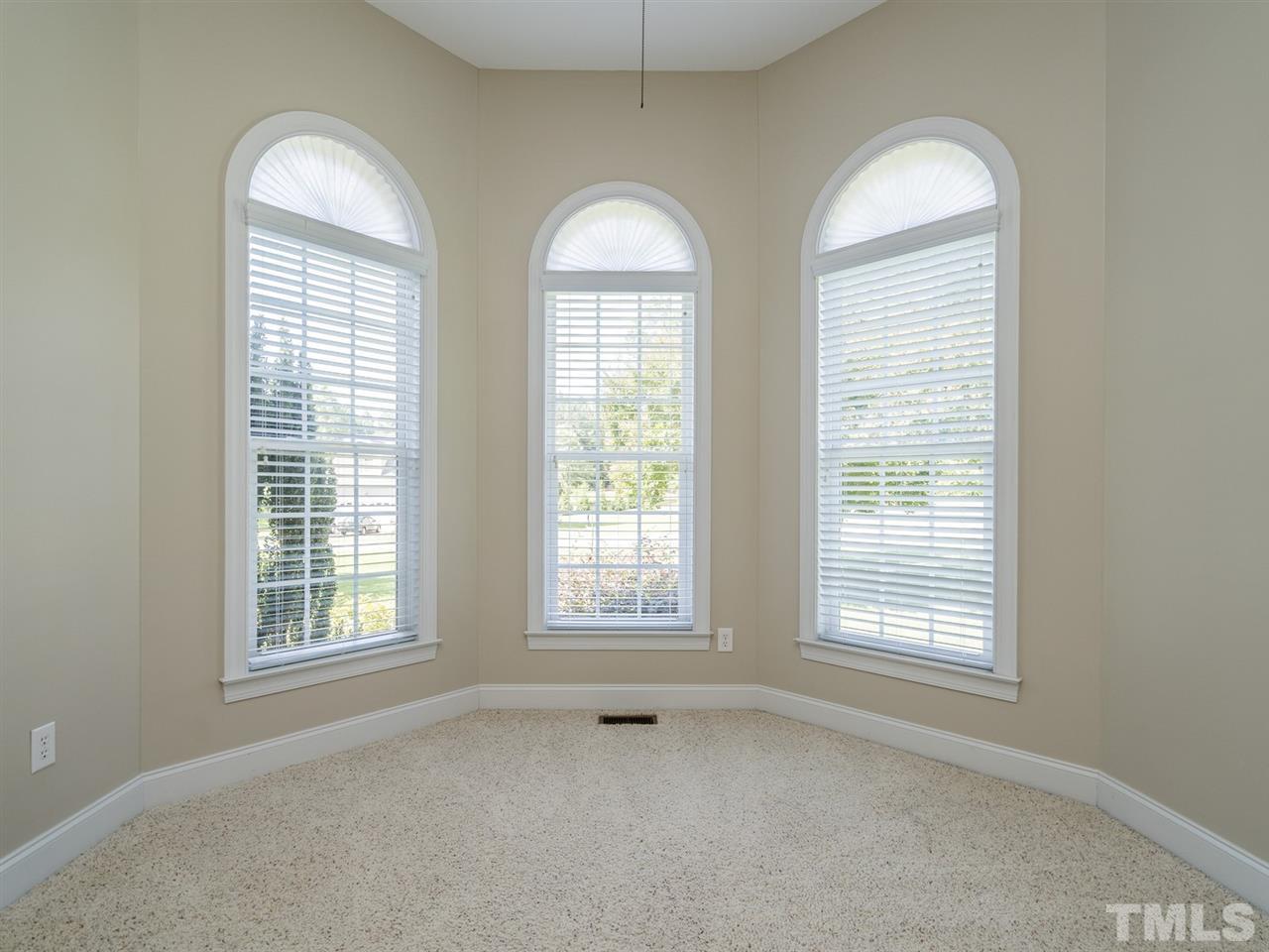1025 Grissom Farm Road Garner, NC 27529 - Photo 4 of 30 This lovely space could function as a formal living room or home office. The bay window adds a lot of charm.