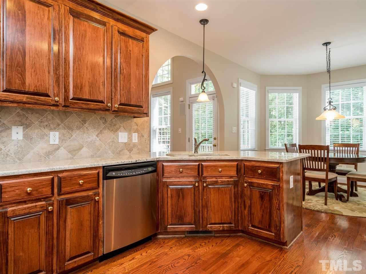 1025 Grissom Farm Road Garner, NC 27529 - Photo 7 of 30 The well-appointed kitchen has stainless appliances.