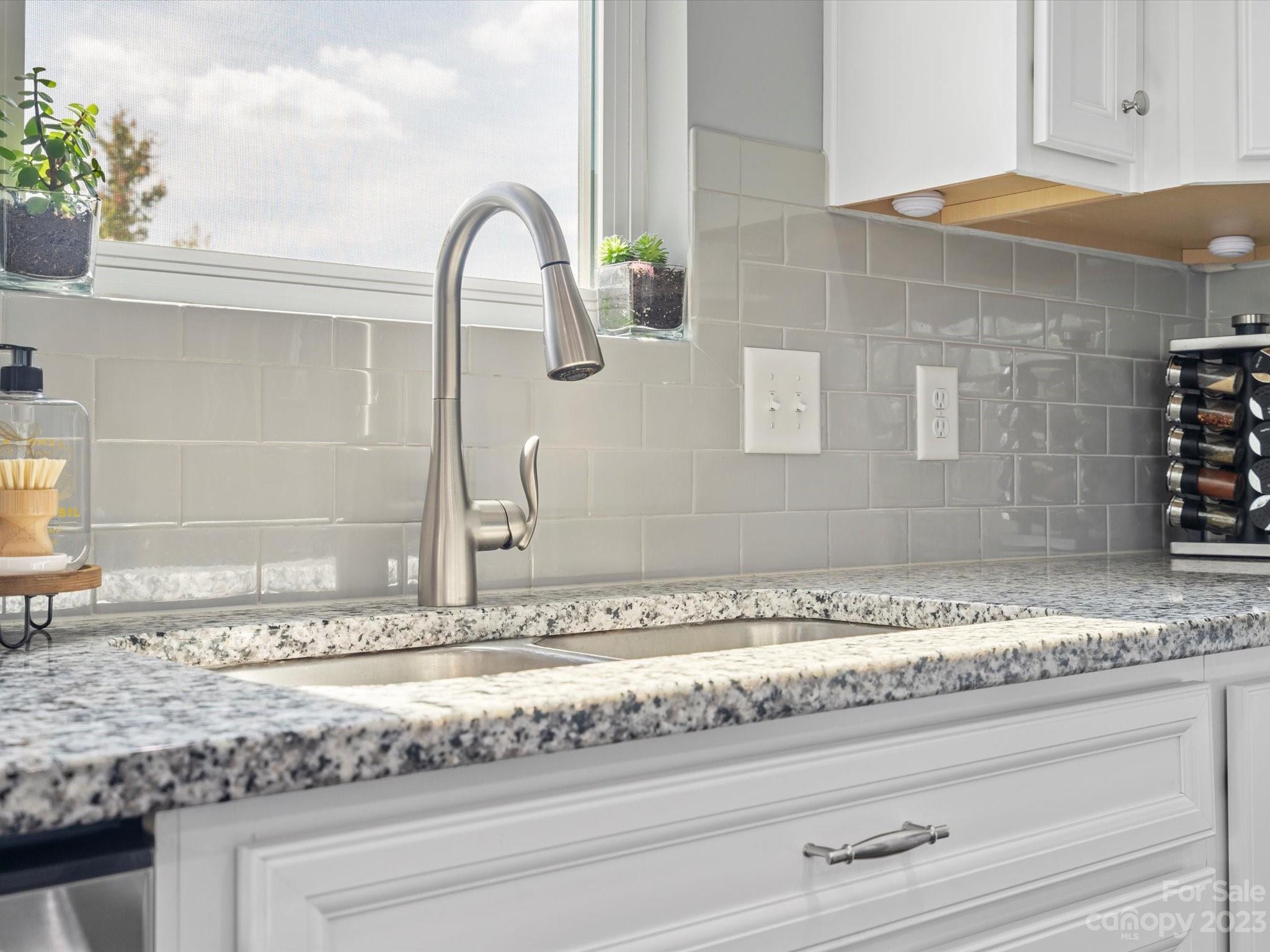 3187 Bridgewater Street Lancaster, SC 29720 - Photo 13 of 37 a close view of a sink and a vanity with granite countertop