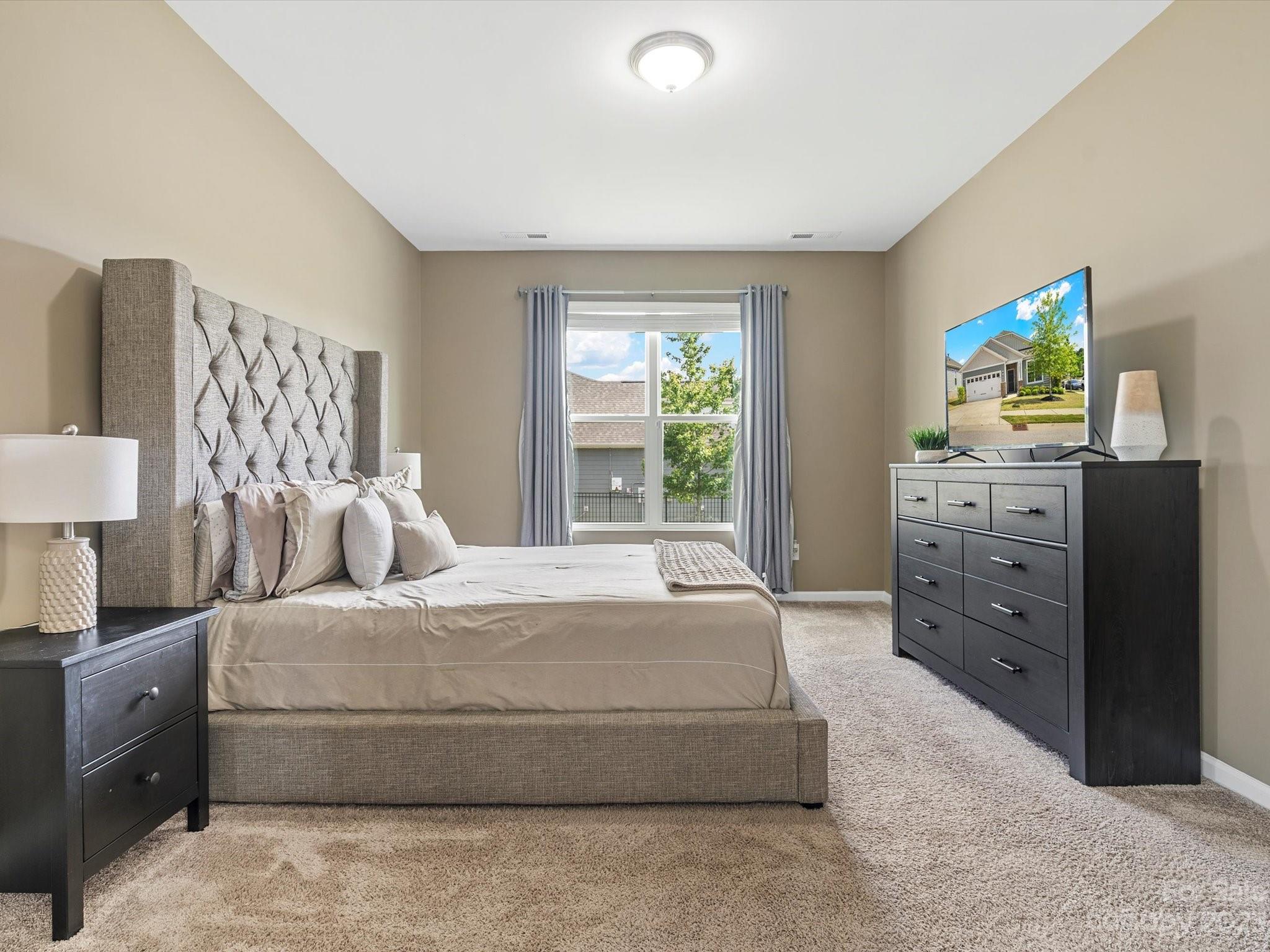 3187 Bridgewater Street Lancaster, SC 29720 - Photo 22 of 37 a bedroom with a bed and a dresser