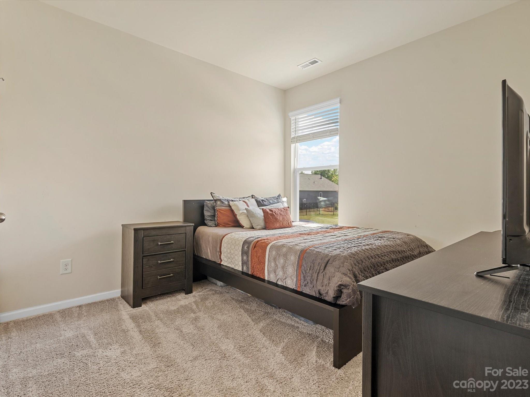 3187 Bridgewater Street Lancaster, SC 29720 - Photo 28 of 37 a bedroom with a bed and a desk