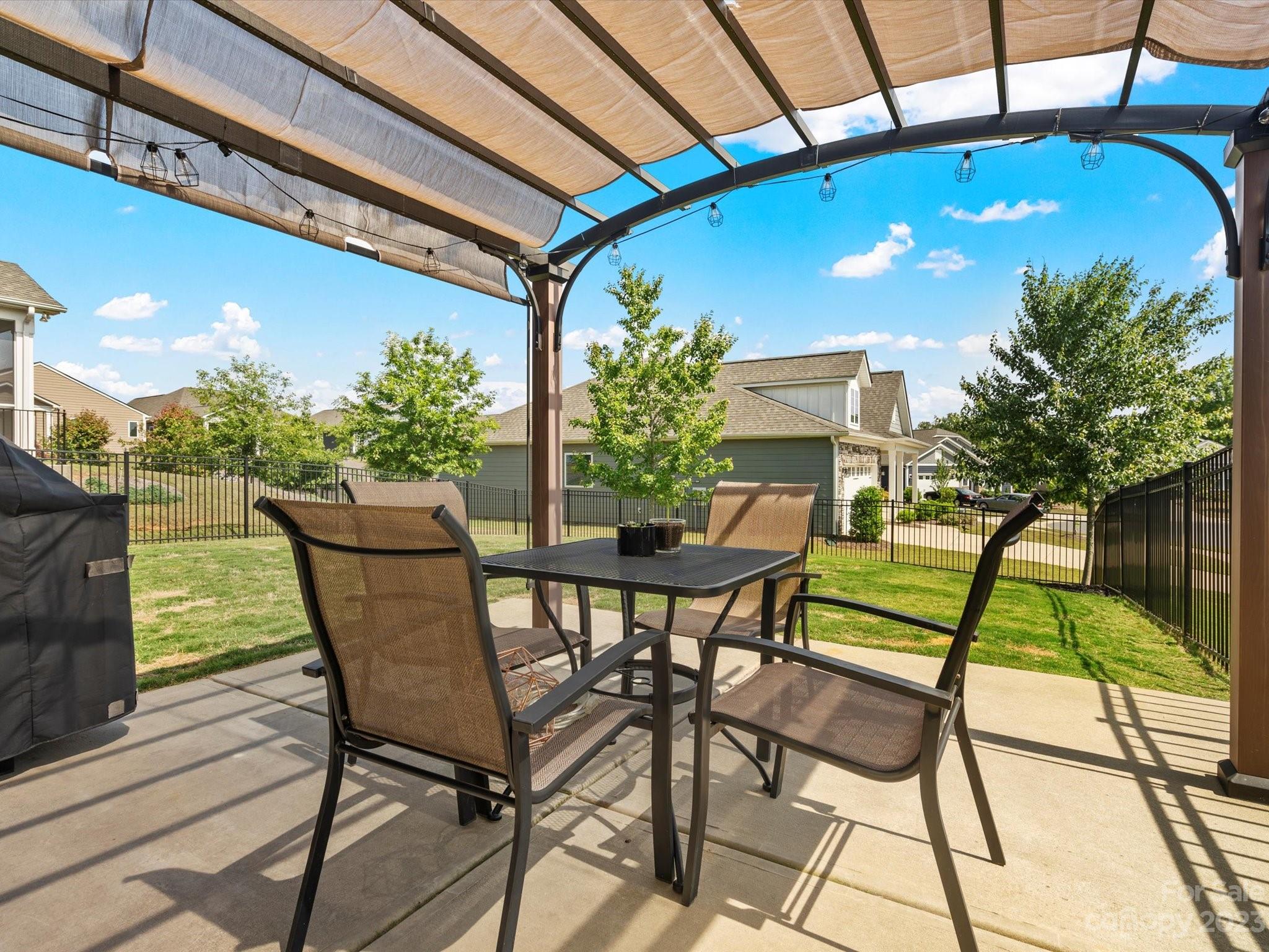 3187 Bridgewater Street Lancaster, SC 29720 - Photo 31 of 37 a view of a patio with table and chairs and potted plants