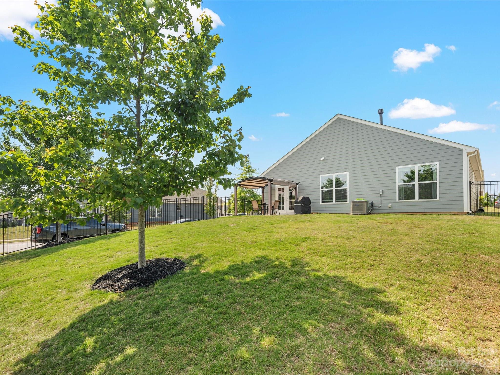 3187 Bridgewater Street Lancaster, SC 29720 - Photo 34 of 37 a front view of house with a garden and tree