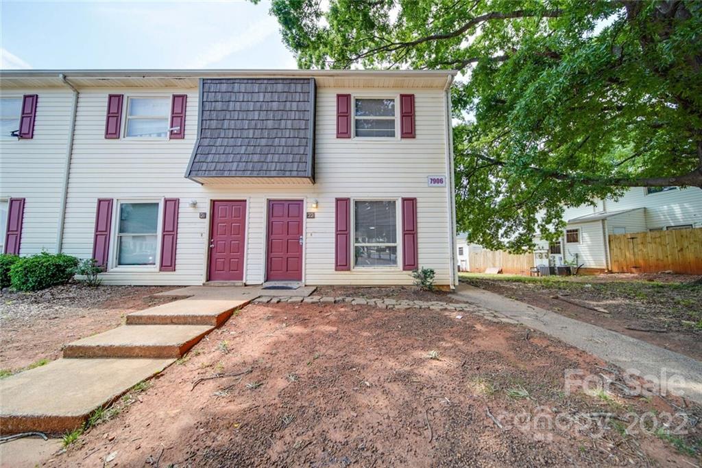 a view of a house with a yard and garage