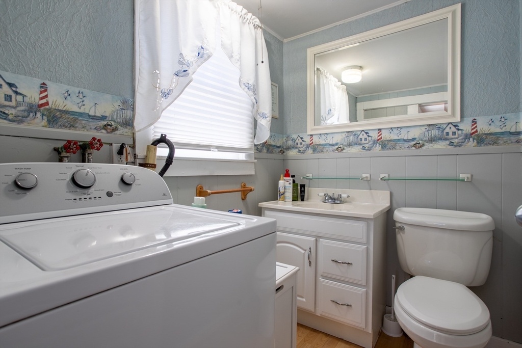 29 Commonwealth Avenue Salisbury, MA 01952 - Photo 17 of 34 a bathroom with a sink toilet vanity and mirror