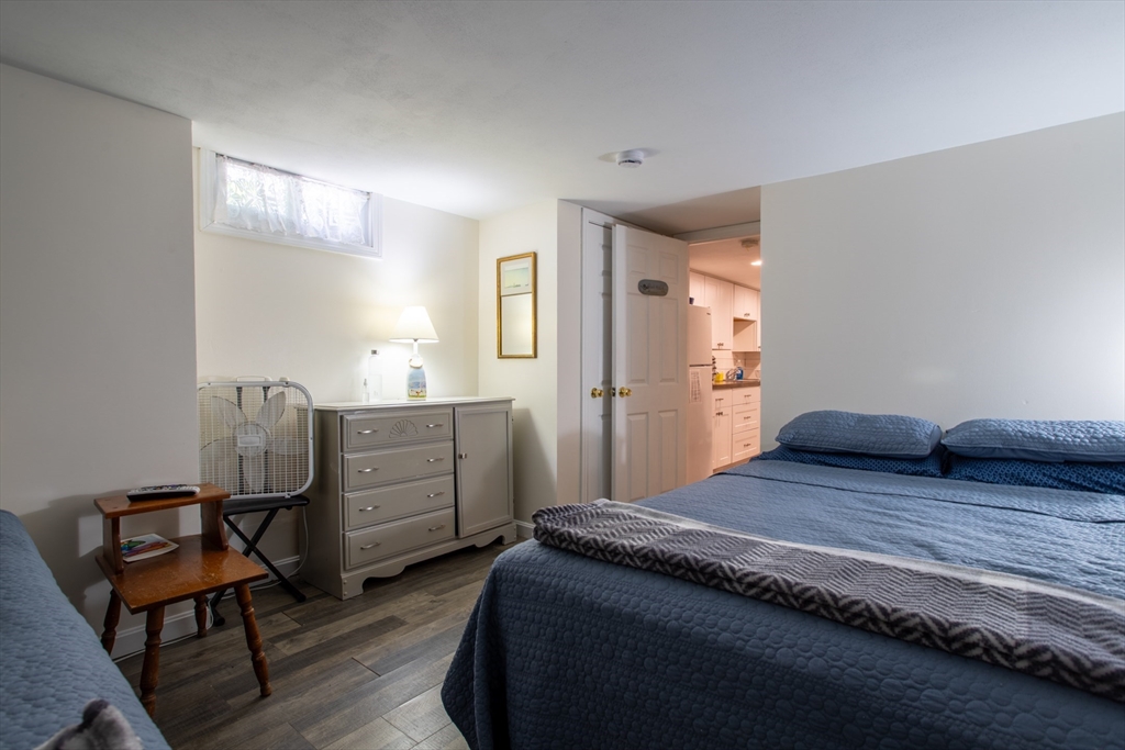 29 Commonwealth Avenue Salisbury, MA 01952 - Photo 27 of 34 a bedroom with a bed and wooden furniture