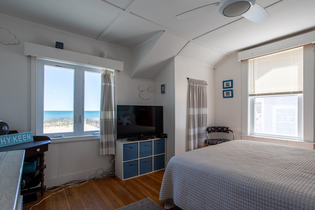 29 Commonwealth Avenue Salisbury, MA 01952 - Photo 5 of 34 a bedroom with a bed and a flat tv screen on dresser