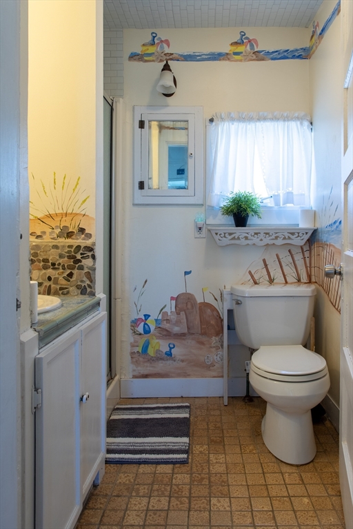 29 Commonwealth Avenue Salisbury, MA 01952 - Photo 8 of 34 a bathroom with a toilet a sink and a window