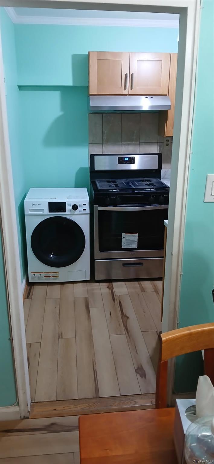 224-04 Manor Road, Unit 103 Queens, NY 11427 - Photo 17 of 28 a bathroom with a sink and a mirror