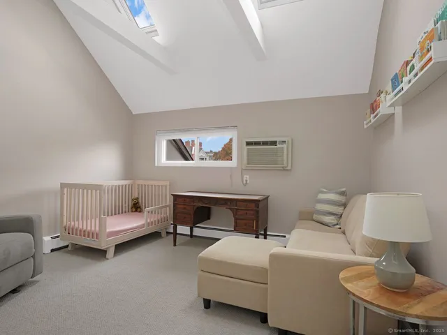 a living room with furniture and a chair