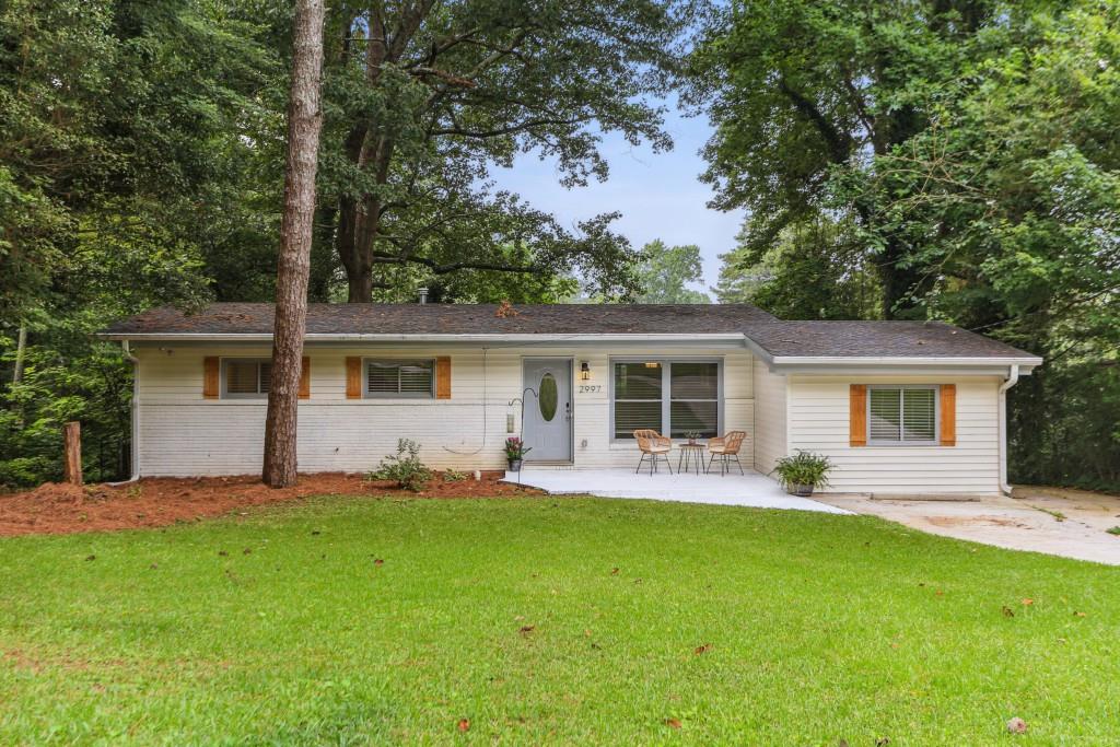 2997 Monterey Drive Decatur, GA 30032 - Photo 1 of 1 a front view of house with yard and green space