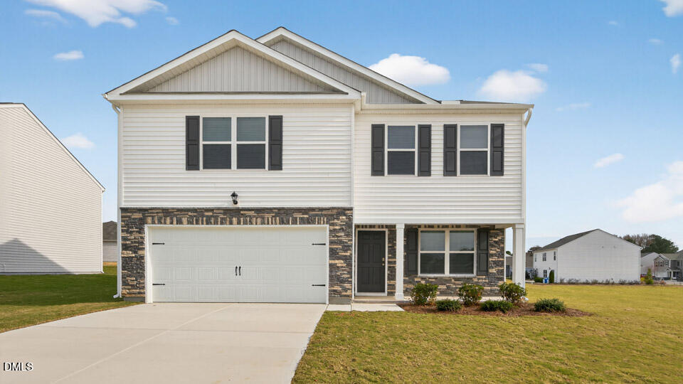 3613 Turney Drive Raleigh, NC 27610 - Photo 1 of 39 a front view of a house with yard and parking