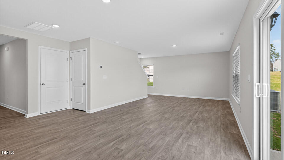 3613 Turney Drive Raleigh, NC 27610 - Photo 12 of 39 a view of an empty room with wooden floor and a window