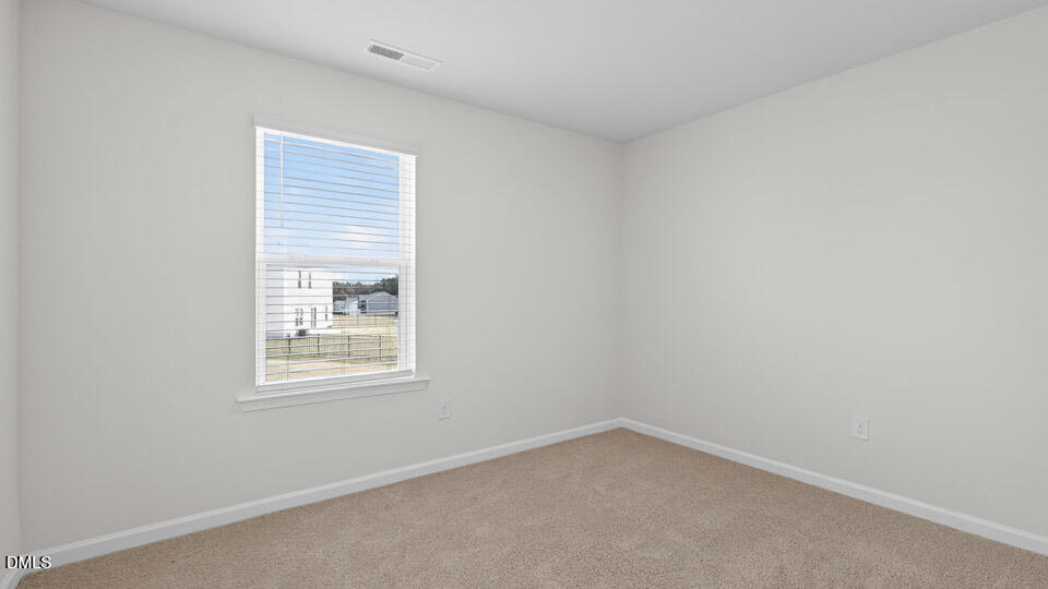 3613 Turney Drive Raleigh, NC 27610 - Photo 21 of 39 an empty room with a window