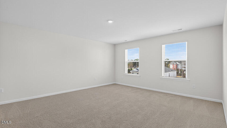 3613 Turney Drive Raleigh, NC 27610 - Photo 25 of 39 an empty room with windows