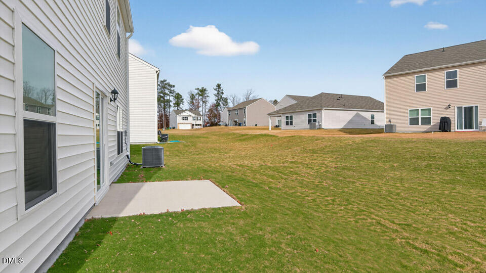 3613 Turney Drive Raleigh, NC 27610 - Photo 34 of 39 a front view of house with yard and seating area