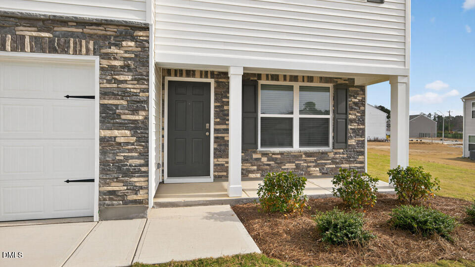 3613 Turney Drive Raleigh, NC 27610 - Photo 4 of 39 a front view of a house with a garden
