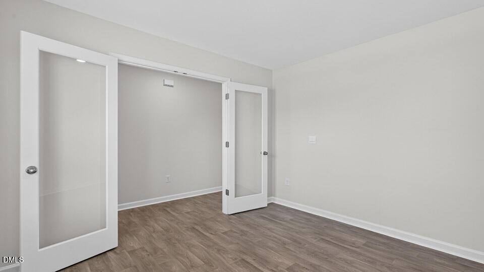 3613 Turney Drive Raleigh, NC 27610 - Photo 7 of 39 a view of an empty room with wooden floor