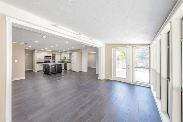 a view of kitchen with furniture and wooden floor